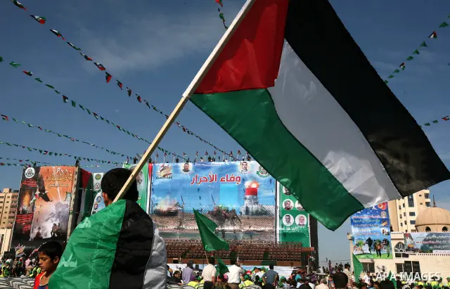 Palestinians participate in the celebrations in Gaza City on October 18, 2011 as an Israeli-Palestinian prisoner swap deal gets under way. Captive Israeli soldier Gilad Shalit was today freed from five years of Hamas cap...
