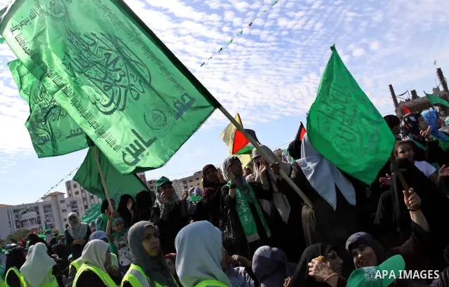 Relatives of Palestinian prisoners about to be freed in a prisoner swap between Hamas and Israel, celebrate as they prepare to receive them in Gaza city October 18, 2011. Gaza's Hamas Islamist rulers released captured Is...