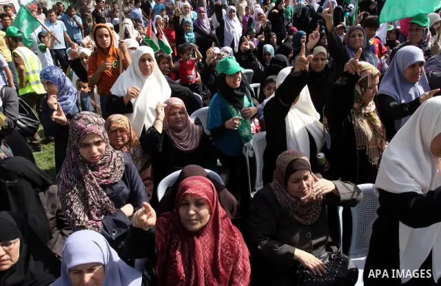Relatives of Palestinian prisoners about to be freed in a prisoner swap between Hamas and Israel, celebrate as they prepare to receive them in Gaza city October 18, 2011. Gaza's Hamas Islamist rulers released captured Is...
