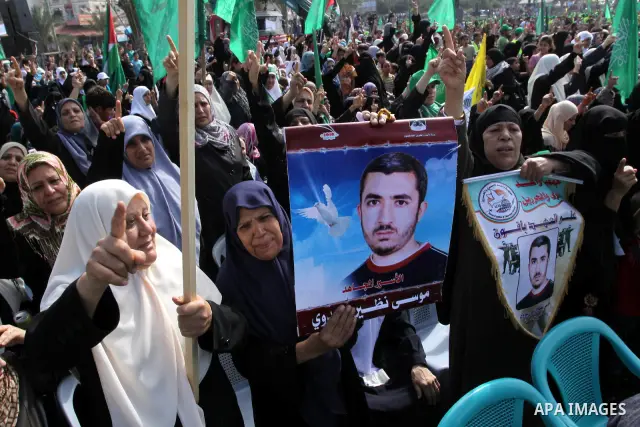 Relatives of Palestinian prisoners about to be freed in a prisoner swap between Hamas and Israel, celebrate as they prepare to receive them in Gaza city October 18, 2011. Gaza's Hamas Islamist rulers released captured Is...