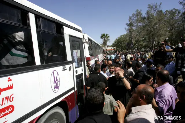 Palestinian prisoners cross to the southern Gaza Strip from the Egyptian side of the Rafah border on Oct. 18, 2011 upon their release from Israeli prisons under a landmark deal to free abducted Israeli soldier Gilad Shal...