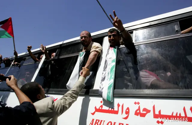 Palestinian prisoners cross to the southern Gaza Strip from the Egyptian side of the Rafah border on Oct. 18, 2011 upon their release from Israeli prisons under a landmark deal to free abducted Israeli soldier Gilad Shal...