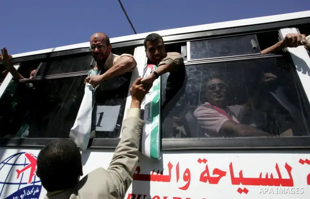 Palestinian prisoners cross to the southern Gaza Strip from the Egyptian side of the Rafah border on Oct. 18, 2011 upon their release from Israeli prisons under a landmark deal to free abducted Israeli soldier Gilad Shal...