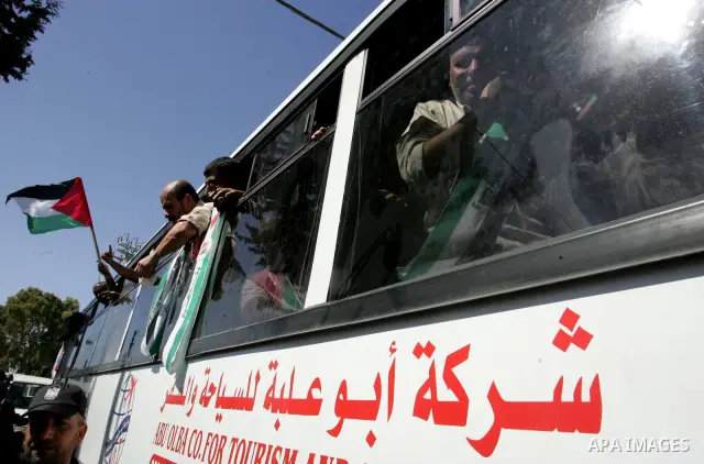 Palestinian prisoners cross to the southern Gaza Strip from the Egyptian side of the Rafah border on Oct. 18, 2011 upon their release from Israeli prisons under a landmark deal to free abducted Israeli soldier Gilad Shal...