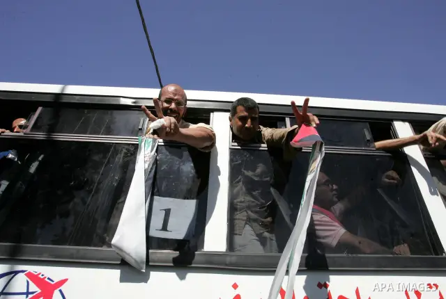 Palestinian prisoners cross to the southern Gaza Strip from the Egyptian side of the Rafah border on Oct. 18, 2011 upon their release from Israeli prisons under a landmark deal to free abducted Israeli soldier Gilad Shal...