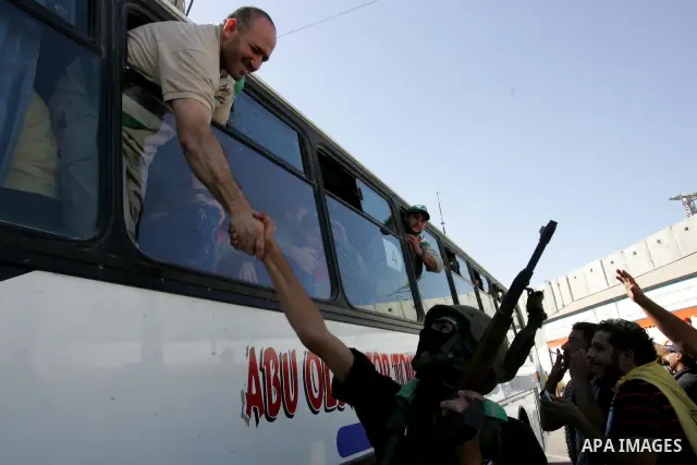 Palestinian prisoners cross to the southern Gaza Strip from the Egyptian side of the Rafah border on Oct. 18, 2011 upon their release from Israeli prisons under a landmark deal to free abducted Israeli soldier Gilad Shal...