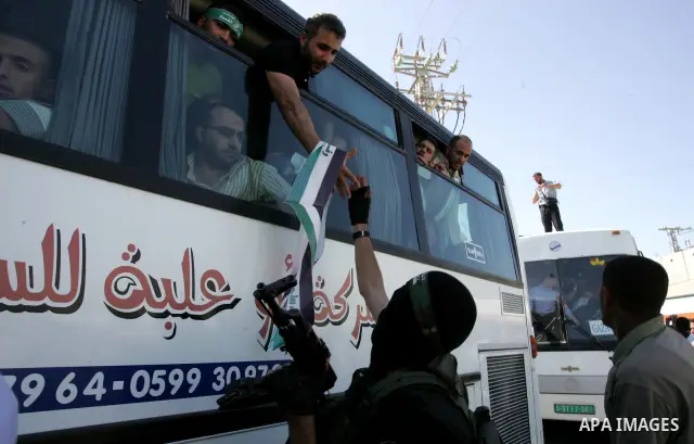 Palestinian prisoners cross to the southern Gaza Strip from the Egyptian side of the Rafah border on Oct. 18, 2011 upon their release from Israeli prisons under a landmark deal to free abducted Israeli soldier Gilad Shal...