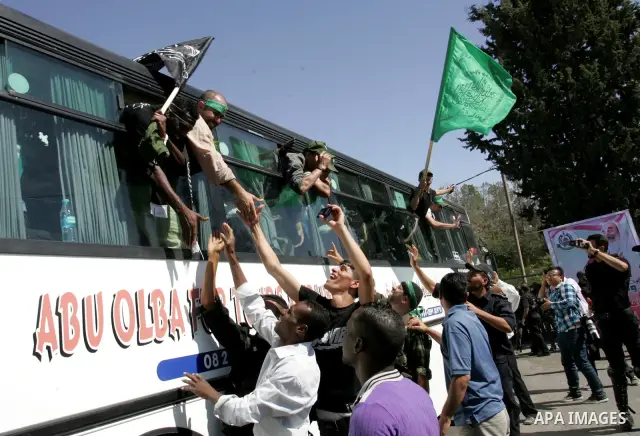 Palestinian prisoners cross to the southern Gaza Strip from the Egyptian side of the Rafah border on Oct. 18, 2011 upon their release from Israeli prisons under a landmark deal to free abducted Israeli soldier Gilad Shal...