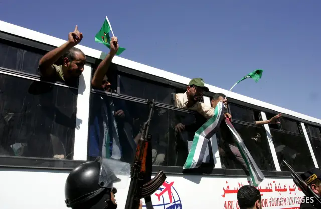 Palestinian prisoners cross to the southern Gaza Strip from the Egyptian side of the Rafah border on Oct. 18, 2011 upon their release from Israeli prisons under a landmark deal to free abducted Israeli soldier Gilad Shal...