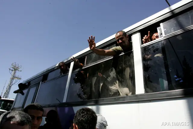 Palestinian prisoners cross to the southern Gaza Strip from the Egyptian side of the Rafah border on Oct. 18, 2011 upon their release from Israeli prisons under a landmark deal to free abducted Israeli soldier Gilad Shal...