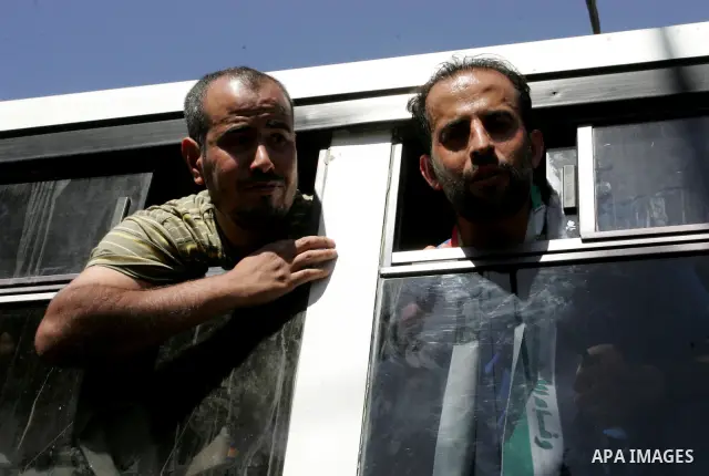 Palestinian prisoners cross to the southern Gaza Strip from the Egyptian side of the Rafah border on Oct. 18, 2011 upon their release from Israeli prisons under a landmark deal to free abducted Israeli soldier Gilad Shal...