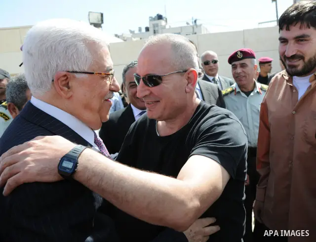 Palestinian president Mahmud Abbas welcomes hundreds of prisoners released from Israeli jails on Oct. 18, 2011 at the Palestinian Authority headquarters in the West Bank city of Ramallah. Hundreds of people gathered in R...