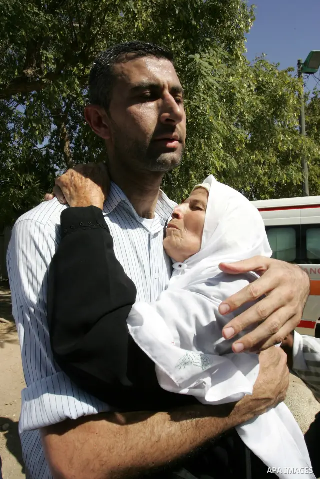 Palestinians greet their relative released Palestinian prisoner at the Rafah border crossing in southern Gaza Strip, Tuesday, Oct. 18, 2011. The Hamas militant group released an Israeli soldier Tuesday more than five yea...