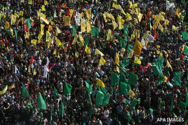 Palestinians celebrate the release of prisoners at al-Kateba square in Gaza city, Tuesday, Oct. 18, 2011. Tens of thousands of flag-waving Palestinians on Tuesday celebrated the homecoming of hundreds of prisoners from I...
