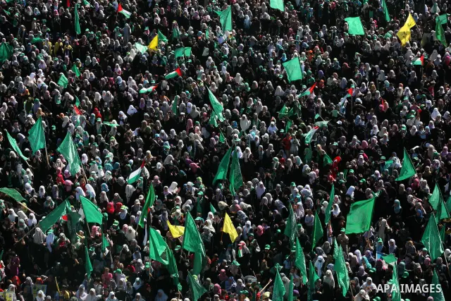 Palestinians celebrate the release of prisoners at al-Kateba square in Gaza city, Tuesday, Oct. 18, 2011. Tens of thousands of flag-waving Palestinians on Tuesday celebrated the homecoming of hundreds of prisoners from I...