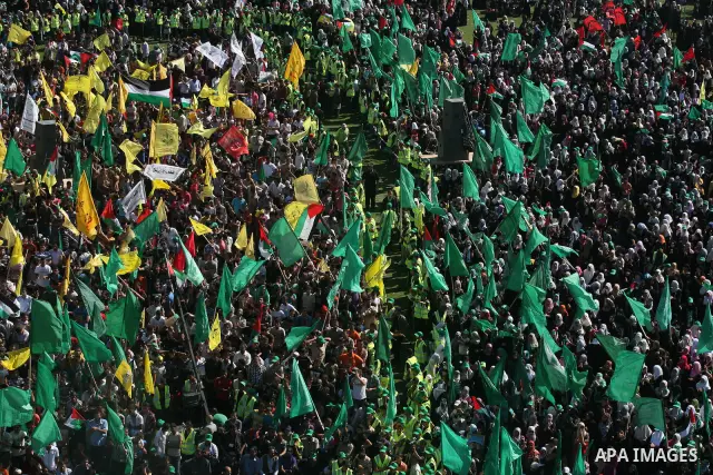 Palestinians celebrate the release of prisoners at al-Kateba square in Gaza city, Tuesday, Oct. 18, 2011. Tens of thousands of flag-waving Palestinians on Tuesday celebrated the homecoming of hundreds of prisoners from I...