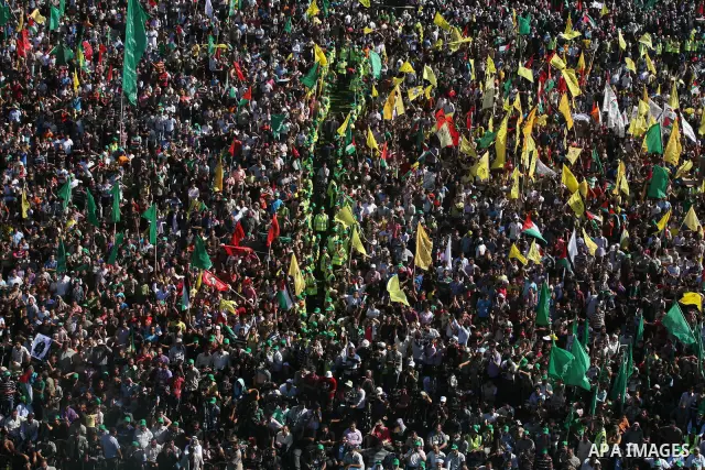 Palestinians celebrate the release of prisoners at al-Kateba square in Gaza city, Tuesday, Oct. 18, 2011. Tens of thousands of flag-waving Palestinians on Tuesday celebrated the homecoming of hundreds of prisoners from I...