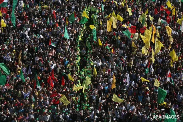 Palestinians celebrate the release of prisoners at al-Kateba square in Gaza city, Tuesday, Oct. 18, 2011. Tens of thousands of flag-waving Palestinians on Tuesday celebrated the homecoming of hundreds of prisoners from I...