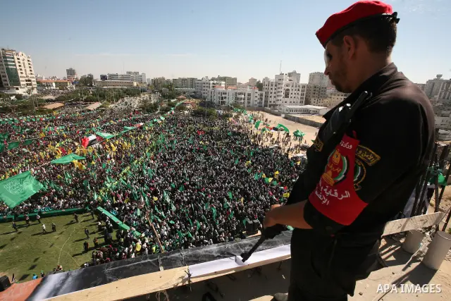 Palestinians celebrate the release of prisoners at al-Kateba square in Gaza city, Tuesday, Oct. 18, 2011. Tens of thousands of flag-waving Palestinians on Tuesday celebrated the homecoming of hundreds of prisoners from I...