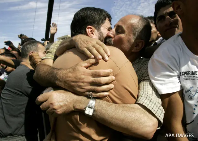 A released Palestinian prisoner is welcomed by relatives in the West Bank city of Ramallah, Tuesday, Oct. 18, 2011. Hamas agreed to release Israeli soldier Galit Schalit in exchange for 1,027 Palestinian prisoners, many...