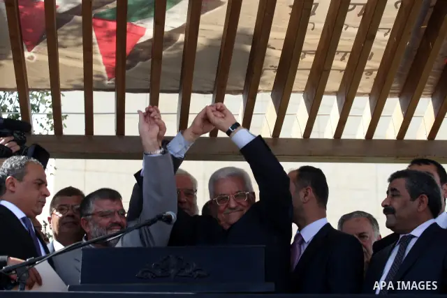 Palestinian president Mahmud Abbas welcomes hundreds of prisoners released from Israeli jails on Oct. 18, 2011 at the Palestinian Authority headquarters in the West Bank city of Ramallah. Hundreds of people gathered in R...