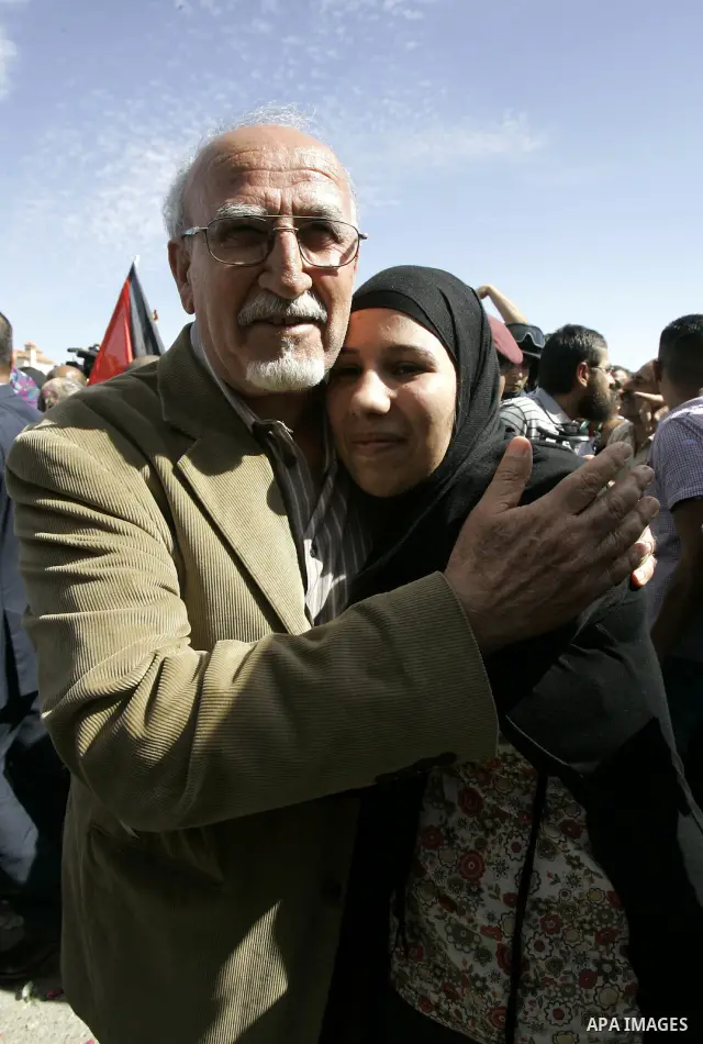 A released Palestinian prisoner is welcomed by relatives in the West Bank city of Ramallah, Tuesday, Oct. 18, 2011. Hamas agreed to release Israeli soldier Galit Schalit in exchange for 1,027 Palestinian prisoners, many...