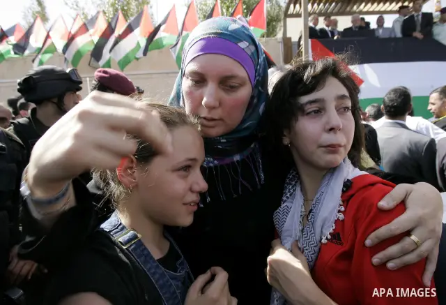 A released Palestinian prisoner is welcomed by relatives in the West Bank city of Ramallah, Tuesday, Oct. 18, 2011. Hamas agreed to release Israeli soldier Galit Schalit in exchange for 1,027 Palestinian prisoners, many...