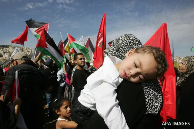 Palestinians wait for former prisoners to be released in East Jerusalem from Israeli prison, Tuesday, Oct. 18, 2011. Hamas agreed to release Israeli soldier Galit Schalit in exchange for 1,027 Palestinian prisoners, many...