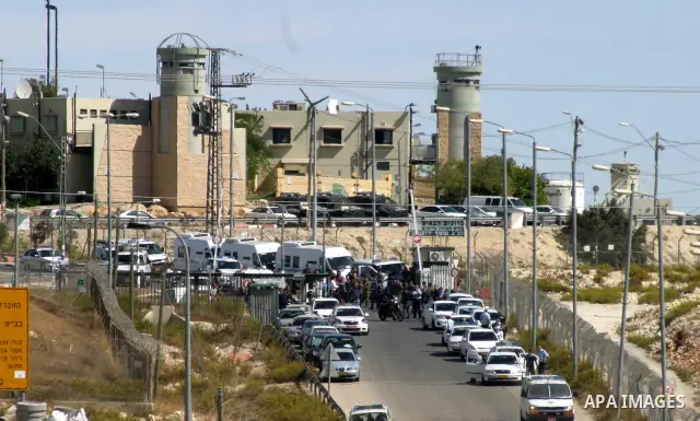 Palestinians wait for former prisoners to be released in East Jerusalem from Israeli prison, Tuesday, Oct. 18, 2011. Hamas agreed to release Israeli soldier Galit Schalit in exchange for 1,027 Palestinian prisoners, many...