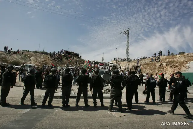 Palestinians wait for former prisoners to be released in East Jerusalem from Israeli prison, Tuesday, Oct. 18, 2011. Hamas agreed to release Israeli soldier Galit Schalit in exchange for 1,027 Palestinian prisoners, many...