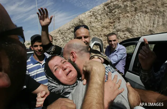 Alaeddin Ahmad Reza Albazian is carried on shoulders after he was released from Israeli prison, as he is greeters in the Arab east Jerusalem neighbourhood of Ras al-Amud October 18, 2011. Israeli soldier Gilad Shalit and...
