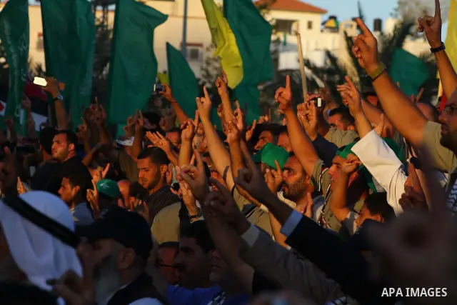Palestinians celebrate the release of prisoners at the main square in Gaza City, Tuesday, Oct. 18, 2011. Hamas agreed to release Israeli soldier Gilad Schalit in exchange for 1,027 Palestinian prisoners, many of them ser...