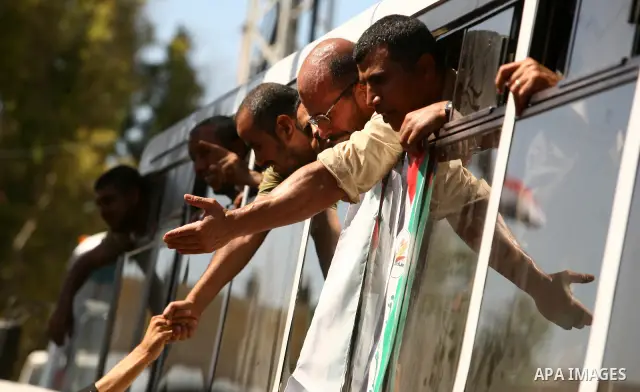 Palestinian prisoners cross to the southern Gaza Strip from the Egyptian side of the Rafah border on Oct. 18, 2011 upon their release from Israeli prisons under a landmark deal to free abducted Israeli soldier Gilad Shal...