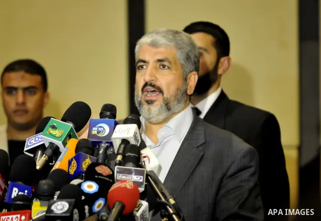 Exiled Palestinian Hamas leader Khaled Meshaal addresses a meeting with some 40 Palestinian prisoners who were freed by Israel but are to be deported overseas, in Cairo on October 18, 2011. Israeli soldier Gilad Shalit w...