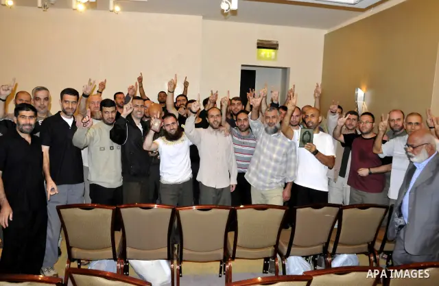 Palestinian released prisoners gather for a meeting with Hamas political leader Khaled Meshal, not pictured, in Cairo, Egypt, Tuesday, Oct. 18, 2011. Hundreds of Palestinians freed from Israeli prisons in exchange for th...