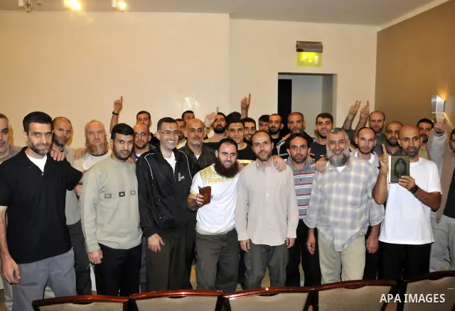 Palestinian released prisoners gather for a meeting with Hamas political leader Khaled Meshal, not pictured, in Cairo, Egypt, Tuesday, Oct. 18, 2011. Hundreds of Palestinians freed from Israeli prisons in exchange for th...
