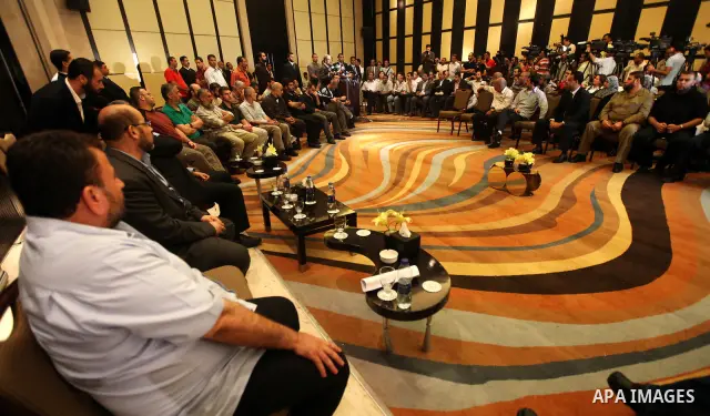 Exiled Palestinian Hamas leader Khaled Meshaal meets with some 40 Palestinian prisoners who were freed by Israel but are to be deported overseas, in Cairo on October 18, 2011. Israeli soldier Gilad Shalit was released in...