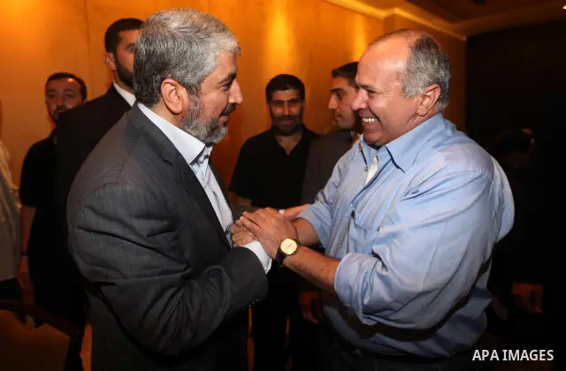 Exiled Palestinian Hamas leader Khaled Meshaal meets with an Egyptian Intellegence cheif, Rafat Shahada, in Cairo on October 18, 2011. Israeli soldier Gilad Shalit was released in a landmark deal which also saw 477 Pales...
