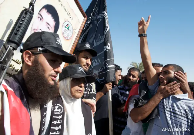 Palestinians celebrate the release of prisoners in Gaza Strip, Tuesday, Oct. 18, 2011. Hamas agreed to release Israeli soldier Galit Schalit in exchange for 1,027 Palestinian prisoners, many of them serving life sentence...