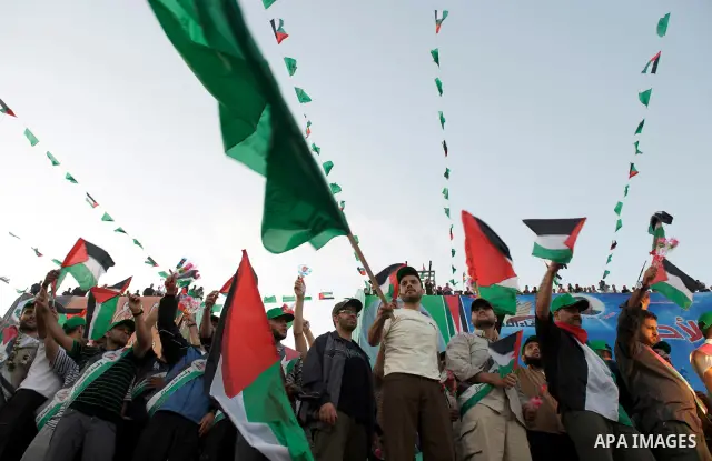 Palestinians celebrate the release of prisoners in Gaza Strip, Tuesday, Oct. 18, 2011. Hamas agreed to release Israeli soldier Galit Schalit in exchange for 1,027 Palestinian prisoners, many of them serving life sentence...