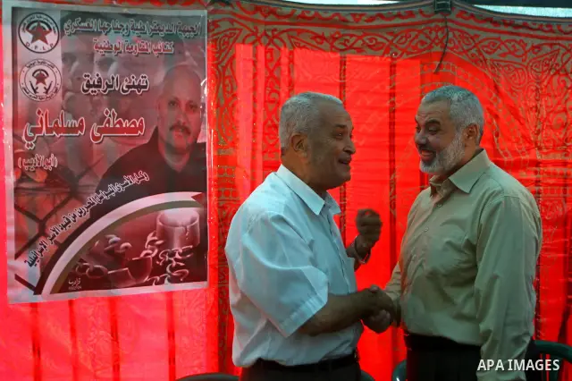 Palestinian prime minister in Gaza Strip, Ismail Haniya visits the tent erected to welcome Palestinian prisoners released in exchange for the captured Israeli soldier Gilad Schalit in Gaza City, Wednesday, Oct. 19, 2011....