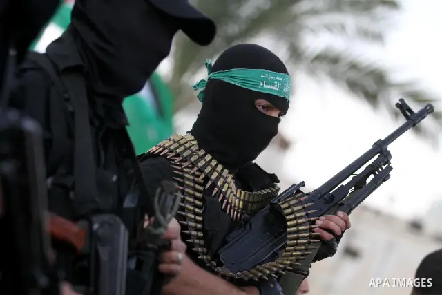 Palestinian Hamas militants stand guard outside the tent erected to welcome Palestinian prisoners released in exchange for the captured Israeli soldier Gilad Schalit in Gaza City, Wednesday, Oct. 19, 2011. Photo by Majdi...