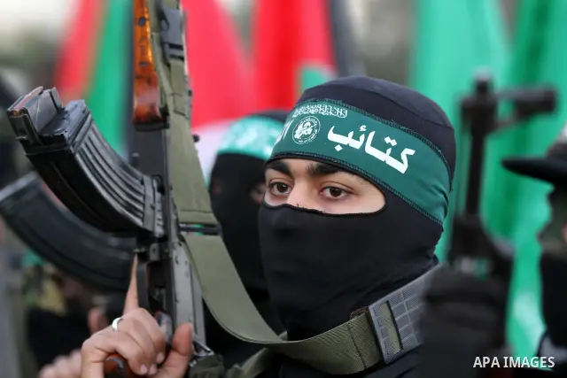 Palestinian Hamas militants stand guard outside the tent erected to welcome Palestinian prisoners released in exchange for the captured Israeli soldier Gilad Schalit in Gaza City, Wednesday, Oct. 19, 2011. Photo by Majdi...