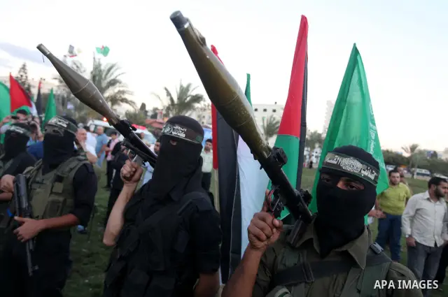 Palestinian Hamas militants stand guard outside the tent erected to welcome Palestinian prisoners released in exchange for the captured Israeli soldier Gilad Schalit in Gaza City, Wednesday, Oct. 19, 2011. Photo by Majdi...