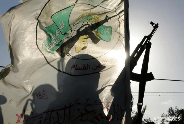 Hamas militants patrol during their visit to the freed Palestinian prisoners in Rafah in southern Gaza Strip October 19, 2011. Palestinians freed by Israel in a trade for soldier Gilad Shalit took their morning exercise...
