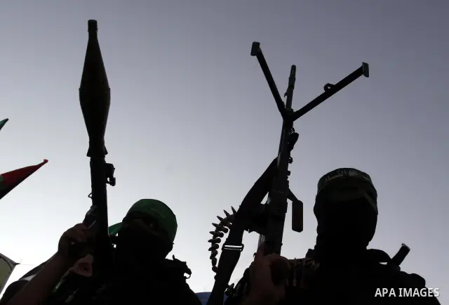 Palestinian Hamas militants stand guard outside the tent erected to welcome Palestinian prisoners released in exchange for the captured Israeli soldier Gilad Schalit in Gaza City, Wednesday, Oct. 19, 2011. Photo by Moham...