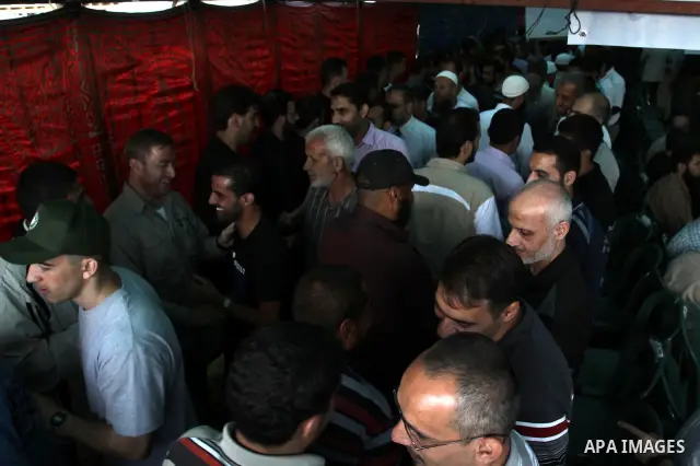 Palestinians shake hands as they visit the tent erected to welcome Palestinian prisoners released in exchange for the captured Israeli soldier Gilad Schalit in Gaza City, Wednesday, Oct. 19, 2011. Photo by Mohammed Asad