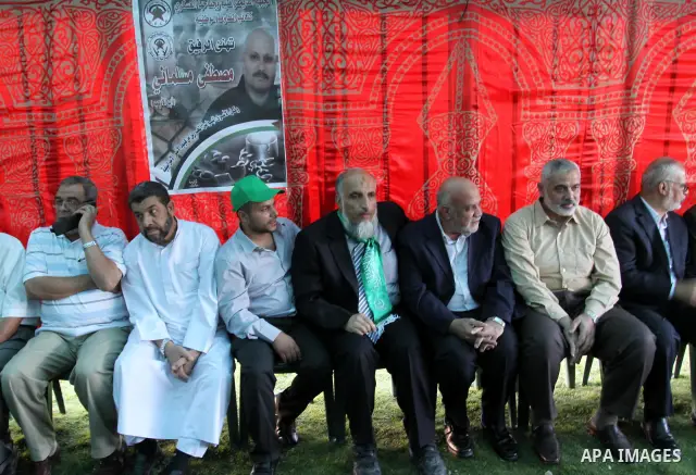 Palestinian prime minister in Gaza Strip, Ismail Haniya visits the tent erected to welcome Palestinian prisoners released in exchange for the captured Israeli soldier Gilad Schalit in Gaza City, Wednesday, Oct. 19, 2011....