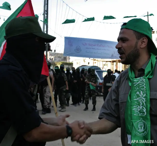 Hamas militants visit Khaled AL Moghiar a freed Palestinian prisoner in Rafah in southern Gaza Strip October 19, 2011. Palestinians freed by Israel in a trade for soldier Gilad Shalit took their morning exercise on Wedne...
