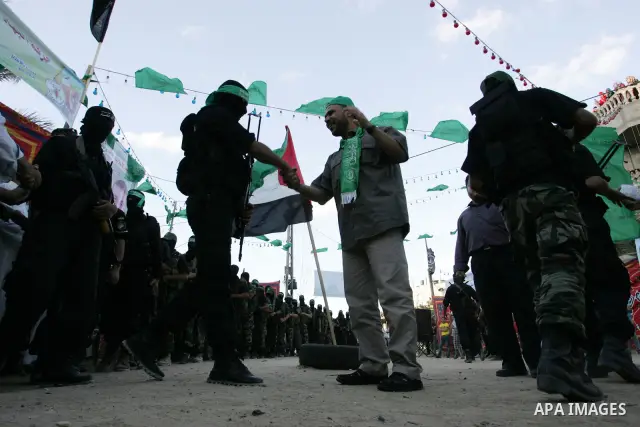 Hamas militants visit Khaled AL Moghiar a freed Palestinian prisoner in Rafah in southern Gaza Strip October 19, 2011. Palestinians freed by Israel in a trade for soldier Gilad Shalit took their morning exercise on Wedne...